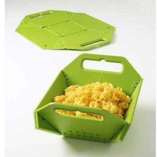 Folding Colander bends and turns to create a deep bowl with two large handles