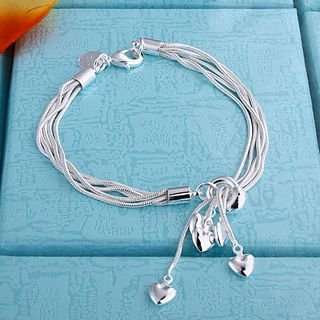Silver bracelet with heart charms