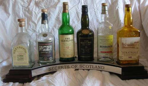 Secrets of Scotland stand & bottles Collectors Item!