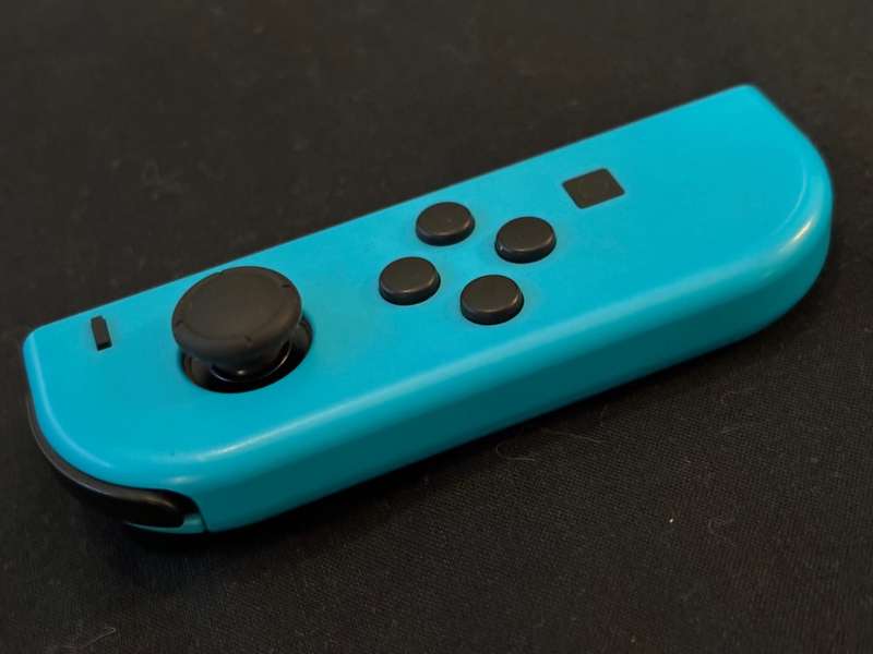 neon blue Left Joy-Con controller for Nintendo Switch with strap