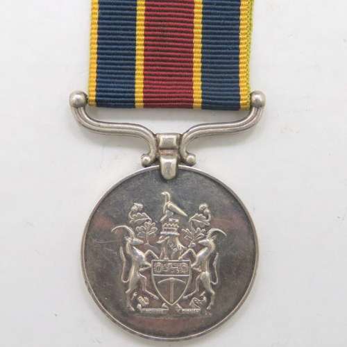 FULL SIZE: Rhodesia Police Reserve for Faithful Service Medal. Issued to C.B Shand