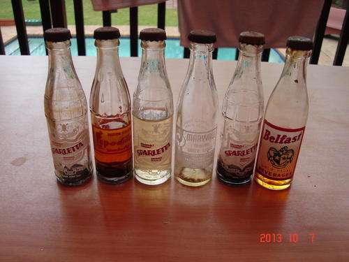 6 miniture cooldrink bottles  heavy evaporation bid for the lot
