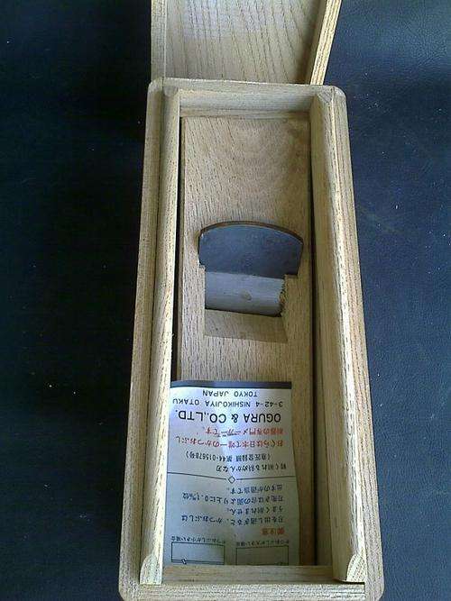 JAPANESE WOOD PLANE IN BOX WITH JAPANESE INSTRUCTIONS. VERY NEAT. LOOKS NEW. SLIGHT RUST ON BLADE.