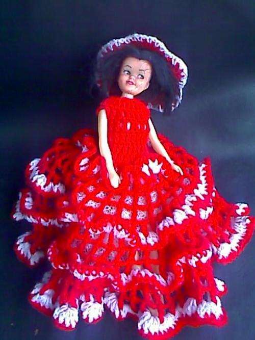 plastic barbie type doll with movable head/arms/legs and handmade outfit.childs name written on back