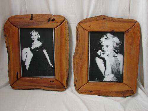 A PAIR OF WOODEN PICTURE FRAMES .