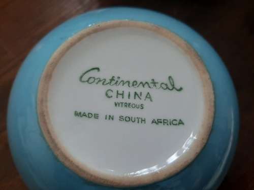 Continential designers tea pot and 2 holders