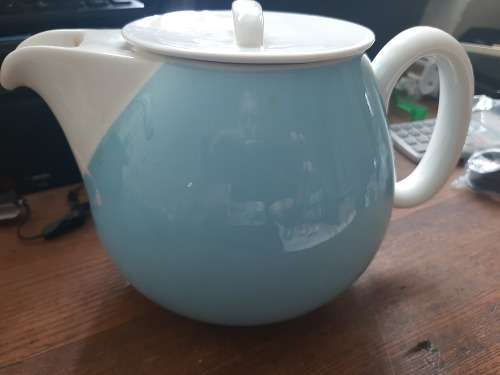 Continential designers tea pot and 2 holders