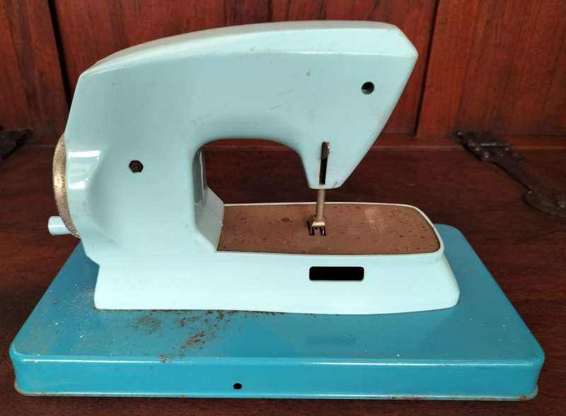 Vintage tin toy sewing machine