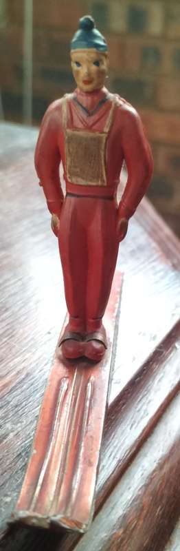 Vintage skier (plastic body, metal skies)