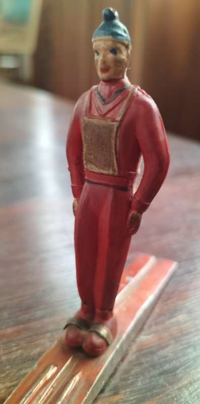 Vintage skier (plastic body, metal skies)