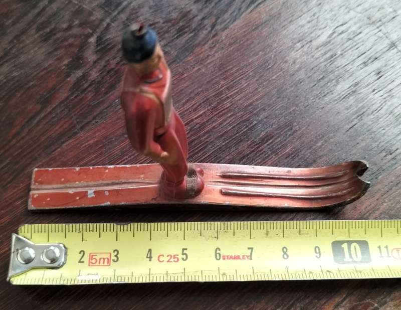 Vintage skier (plastic body, metal skies)