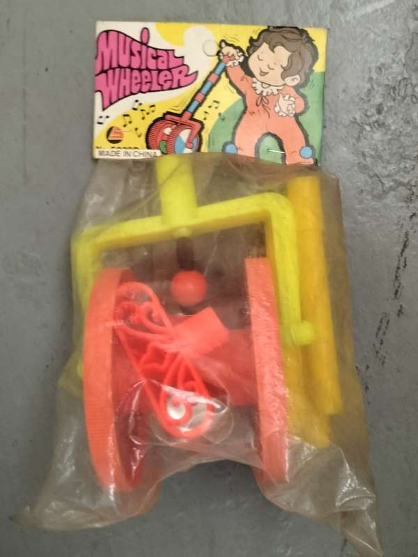 New old stock - plastic musical wheeler (still wrapped)