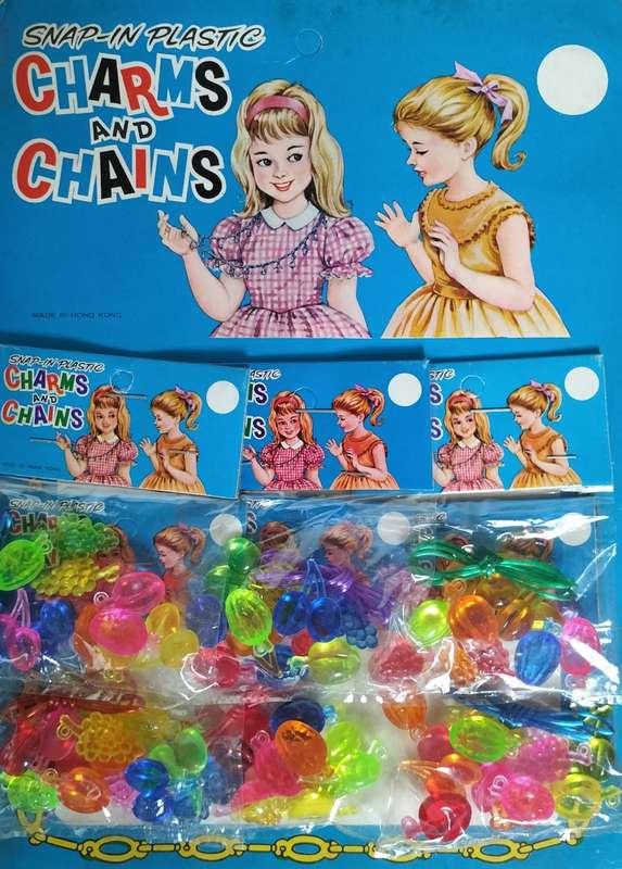 New old stock - plastic charms (X6) stapled to cardboard