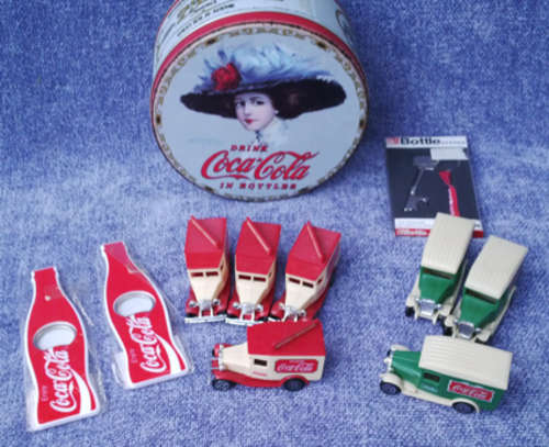 A Collection of Coca-Cola Items - Cars, Tin & More