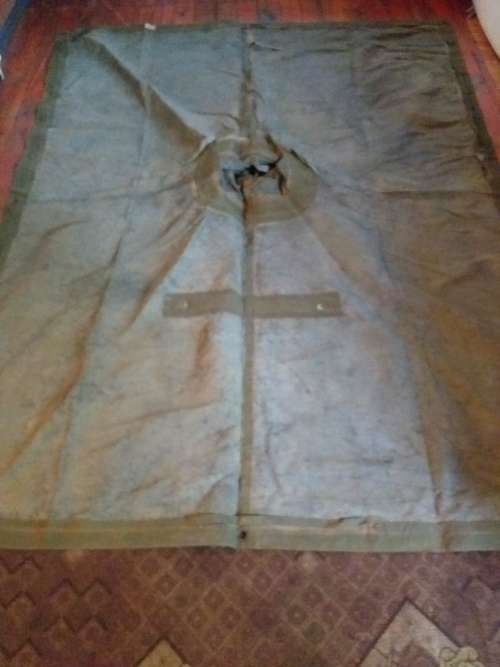 Poncho/Ground sheet with carrier and kidney pouches.
