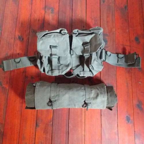 Poncho/Ground sheet with carrier and kidney pouches.