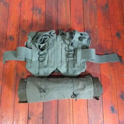 Poncho/Ground sheet with carrier and kidney pouches.