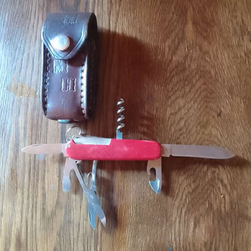 Victorinox with leather pouch.