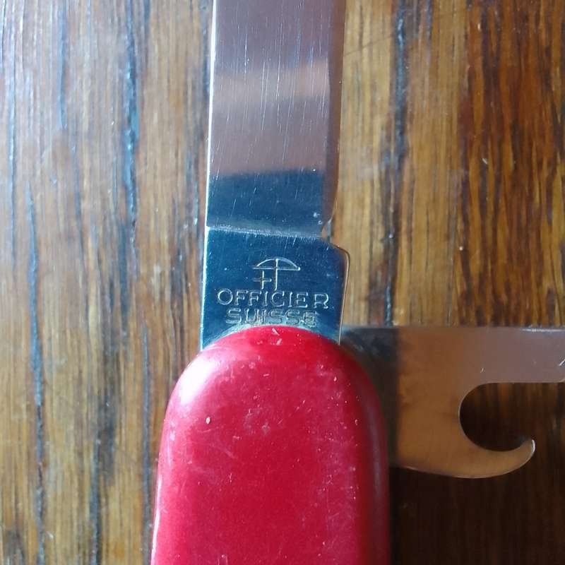 Victorinox with leather pouch.