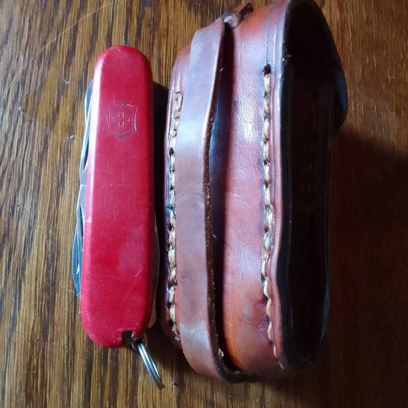 Victorinox with leather pouch.