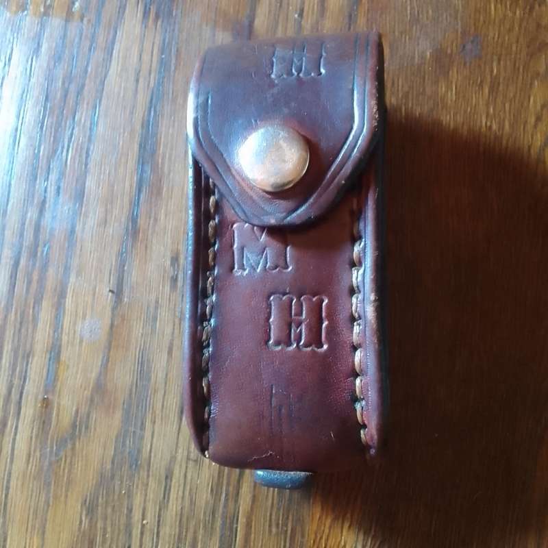 Victorinox with leather pouch.