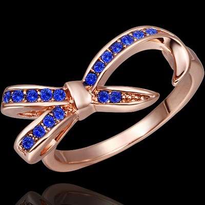 New 18K RGP in rose gold, Ladies bow knot style ring with blue Austrian crystals