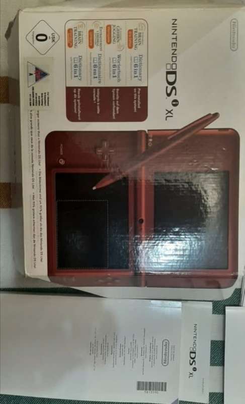 Nintendo Dsi Xl| 7 Games| Stylus|  Original Box and manuals| Charger| 2gb SD Card