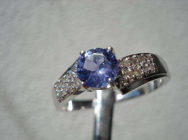 ***R15000***0.60CT TANZANITE RING WITH 16 DIAMONDS IN SOLID 14KT WHITE GOLD