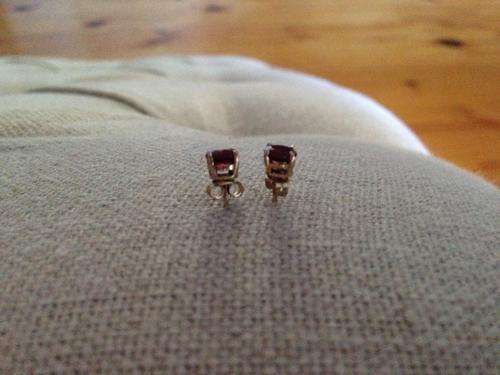 pair of 9ct gold and garnet studs
