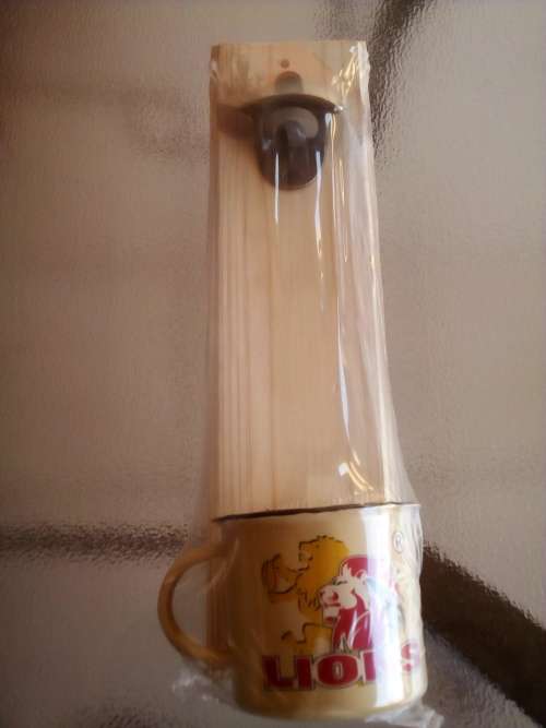 LIONS RUGBY WALL MOUNT BOTTLE OPENER + ENAMEL CUP GIFT PACK. Collections are allowed.