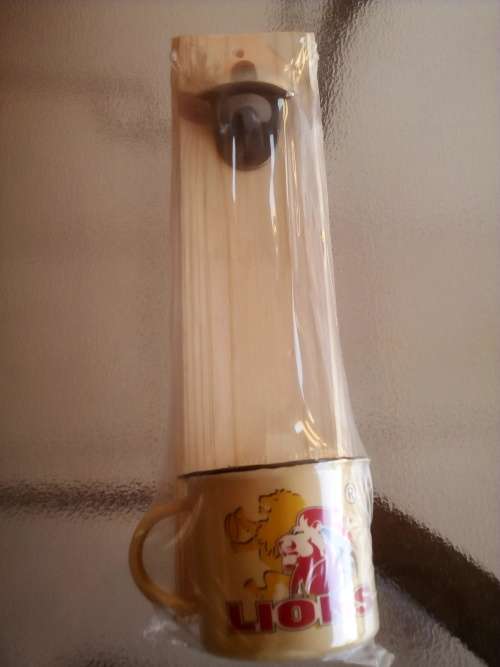 LIONS RUGBY WALL MOUNT BOTTLE OPENER + ENAMEL CUP GIFT PACK. Collections are allowed.