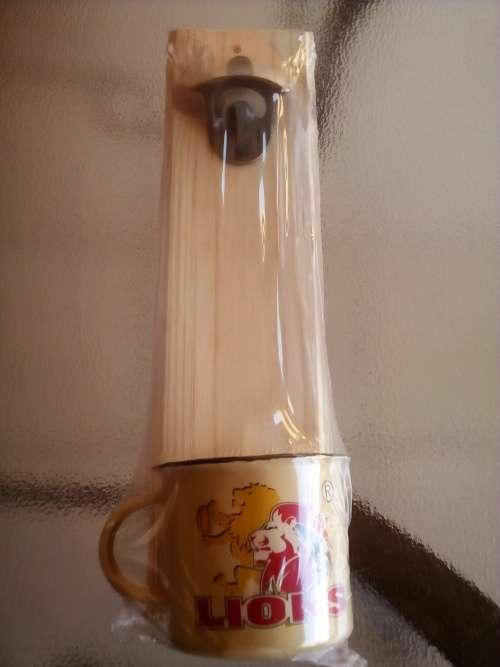 LIONS RUGBY WALL MOUNT BOTTLE OPENER + ENAMEL CUP GIFT PACK. Collections are allowed.