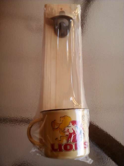 LIONS RUGBY WALL MOUNT BOTTLE OPENER + ENAMEL CUP GIFT PACK. Collections are allowed.