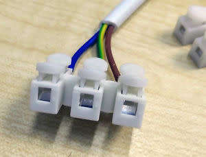 Triple-Wire Spring Push Down Connector. Collections are allowed.
