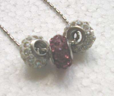Trio of glitter balls on silver chain