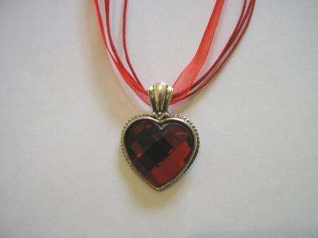 Beautiful red lucite heart on red ribbon