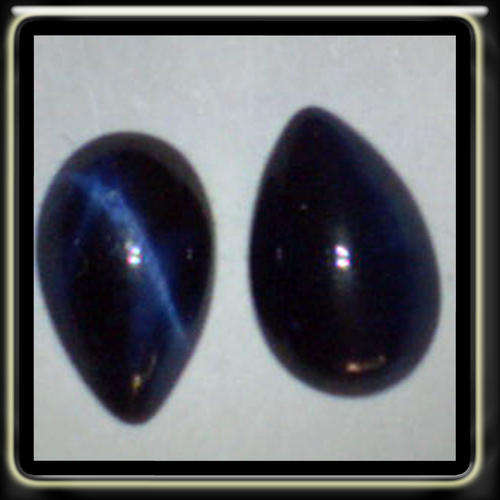 1.37CT TWO BEAUTIFULL OPAGUE CATS EYES POLISHED CABOCHON PEAR GEMSTONES