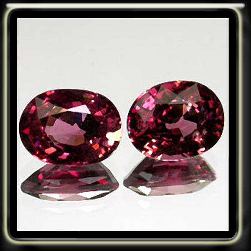 1.90CT A PAIR OF IMMACULATE NATURAL PURPLE PINK RHONDOLITE GARNETS, POLISHED IN A OVAL