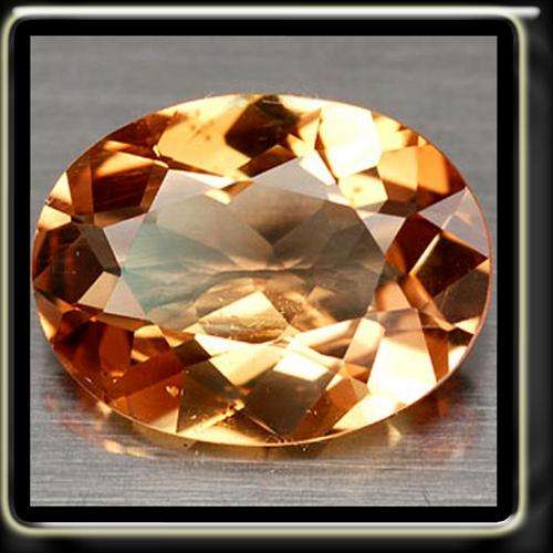 AMAZING 1.61CT NATURAL IMPERIAL SHERRY TOPAZ, A POLISHED UNHEATED OVAL GEMSTONE