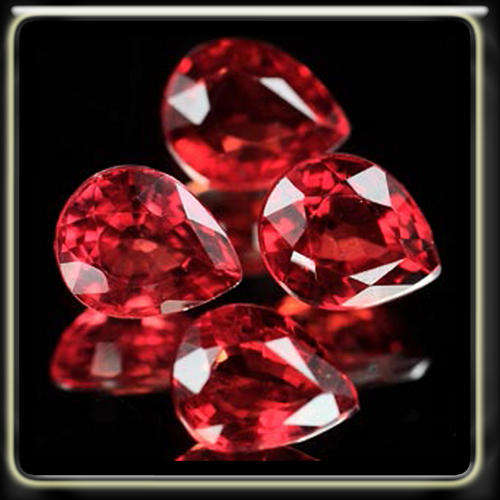 1.06CT ABSOLUTELY STUNNING ORANGEY RED SONGEA SAPPHIRES, A PAIR OF PEAR POLISHED GEMSTONES