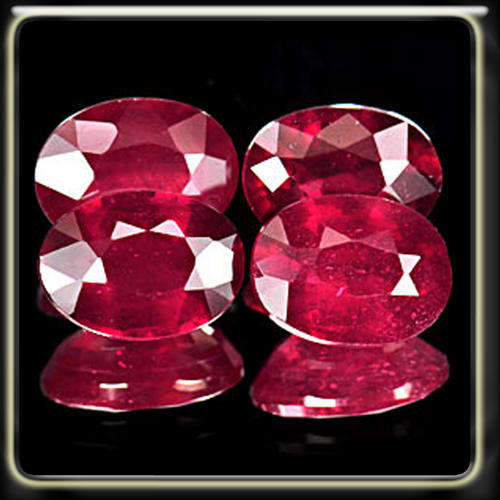 DESIRABLE 4.63CT PARCEL OF 4 NATURAL PURPLISH RED RUBIES MASTERFULLY MODERN OVALS