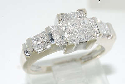 R50000 - DAZZLING 1.00CT INVISIBLE SET PRINCESS CUT DIAMOND RING