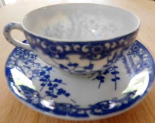 Oriental blue and white eggshell cup and saucer