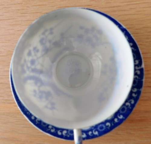 Oriental blue and white eggshell cup and saucer