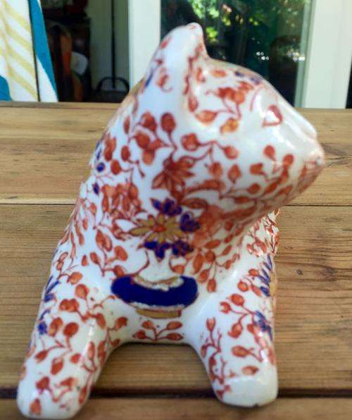 Kutani reclining porcelain cat