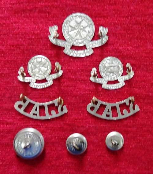Complete set of St. Johns Ambulance insignia with three different sizes of buttons.