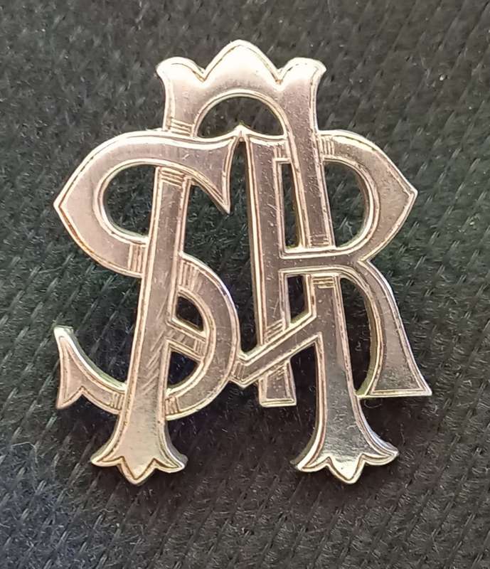 Early white metal South African Railways Slouch Hat Badge