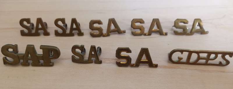 Assorted South African Brass Titles lugs intact