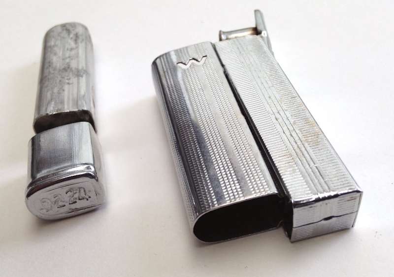 Vintage fluid and flint lighter "W" with removable fuel tank.