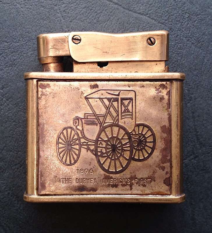 Vintage brass Penguin "Whirlwind" Lighter commemorating The Duryea - America's First, 1896.